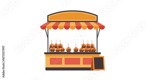 Caramel apple stand featuring rows of the treats under a striped awning