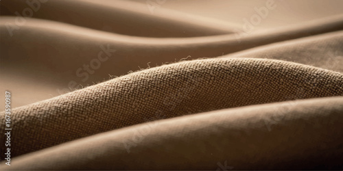 Closeup of soft, textured brown fabric with gentle folds and curves, highlighting its smooth surface and warm hue