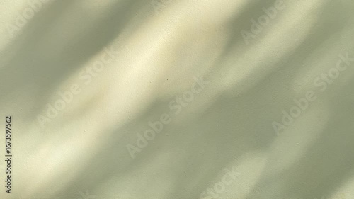 Blurred sunlights on an empty yellow wall background.