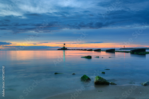 Fototapeta Naklejka Na Ścianę i Meble -  Sunset over the Baltic Sea beach in Gorki Zachodnie, Gdansk. Poland