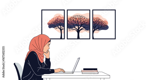 Focused woman wearing hijab works on laptop in modern workspace with abstract tree art