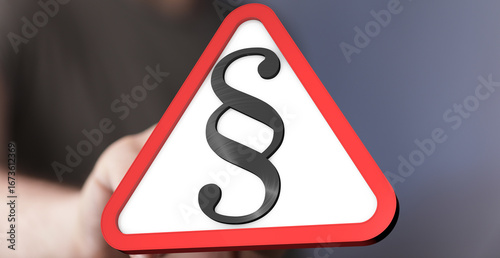 Hand holding a red triangle...