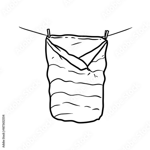Sleeping bag hanging outside on a clothesline to air out