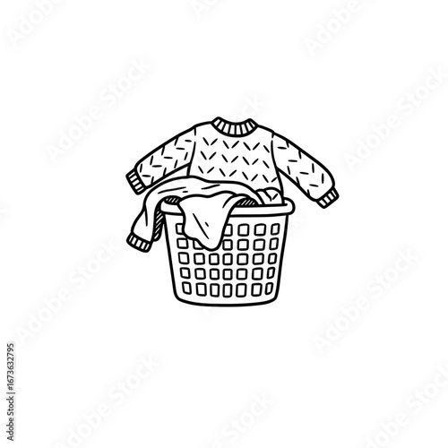 Knit sweater and laundry in a basket in monochrome style  