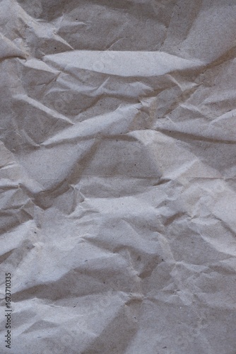 Brown crumpled recycled paper texture background. Kraft Paper