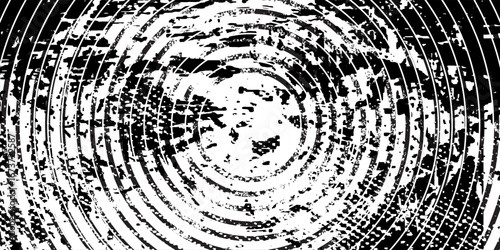 Distressed background in black and white texture with  bulldozer tracks,dark spots, scratches and lines. Abstract vector illustration