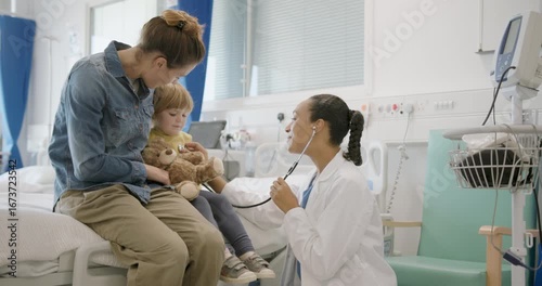 Child with Doctor and Mother, Medical Exam in Doctor's Office