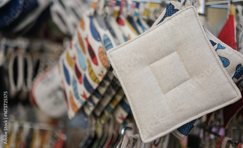 Fototapeta Naklejka Na Ścianę i Meble -  Cotton kitchen potholders at Provence, France street market. Traditional local crafts and sustainable tourism. 
