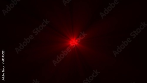 Abstract red flare bright light bursting from center on black background