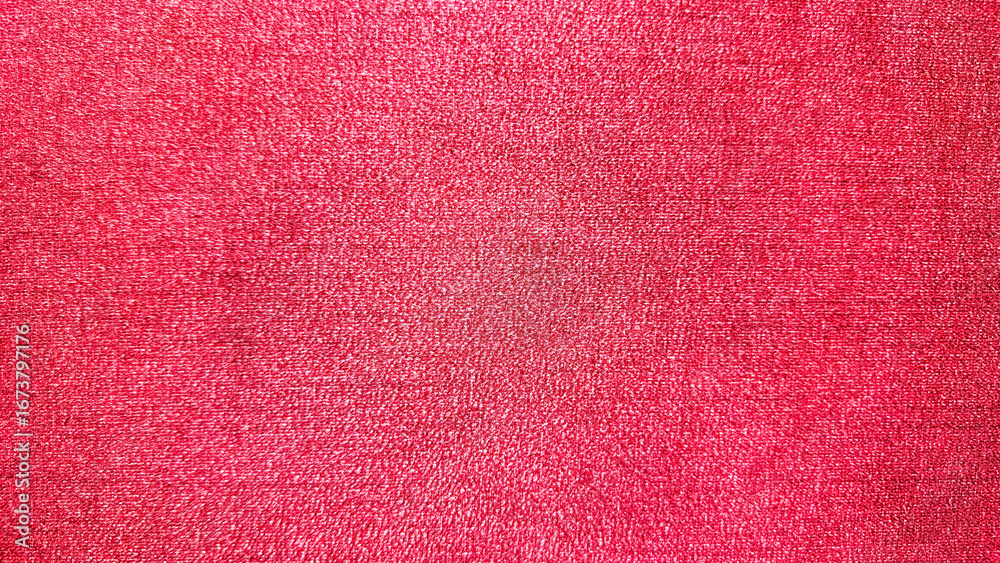 Fototapeta premium Vibrant red fabric texture background with soft woven pattern, ideal for abstract design, textile themes, wallpapers, and creative Christmas graphic projects.