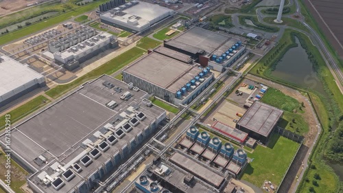 Aerial shot of digital data center facility, cooling towers and IT systems