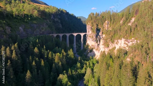 Aerial view Landwasser Viaduct world, protected by UNESCO. Railway scenic route in Switzerland Viaduct in the Swiss Alps, famous bridge.The Rhaetian Railway section from the Bernina area