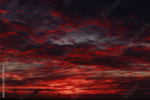 Dramatic sunset cloudscape, fiery reds and deep grays
