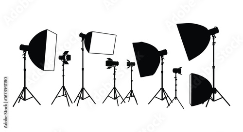 A collection of photography lighting equipment and camera stands in black silhouette