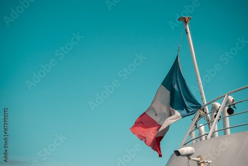 French flag flying on the rear of a ferry
