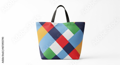 Colorful geometric pattern tote bag with black handles against a white background, providing a modern and vibrant aesthetic