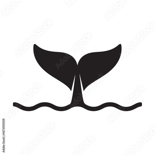 Black silhouette of a whale's tail fin emerging from wavy water