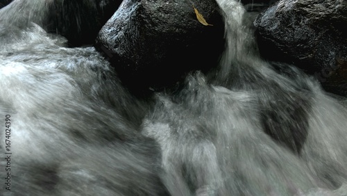 Scenic river with flowing water, rocks, trees, underwater view and sun reflection
