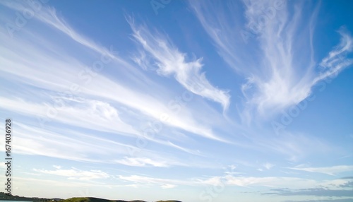 Wispy clouds against a vibrant blue sky