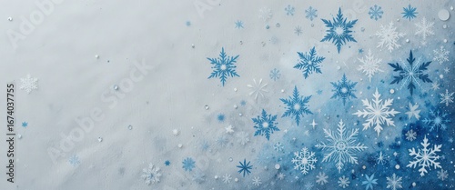 Blue and white snowflakes on frosty gradient background for winter theme design.