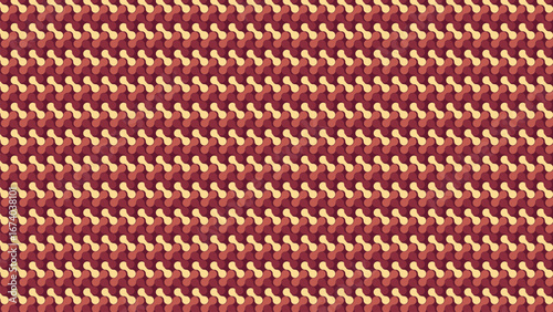 Close up of woven fabric with repeating pattern of red and gold threads