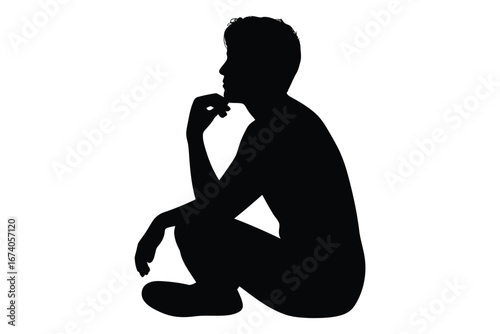 Silhouette of a person crouching and deep in thought with hand on chin