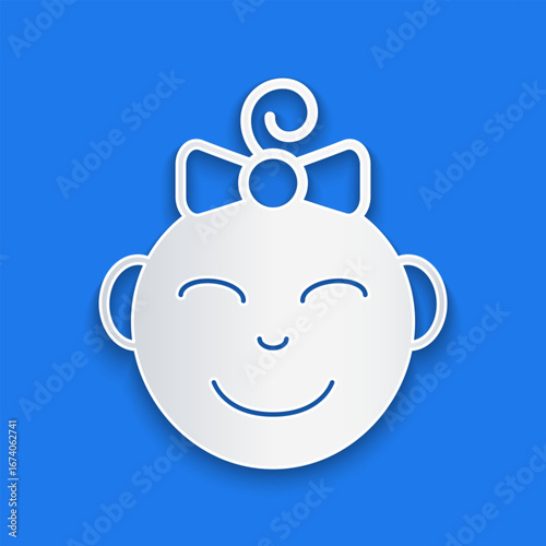 Paper cut Happy little girl head icon isolated on blue background. Face of baby girl. Paper art style. Vector