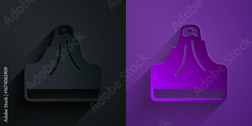 Paper cut Volcano icon isolated on black on purple background. Paper art style. Vector
