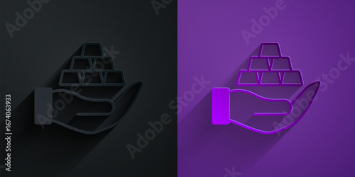 Paper cut Gold bars in hand icon isolated on black on purple background. Banking business concept. Paper art style. Vector