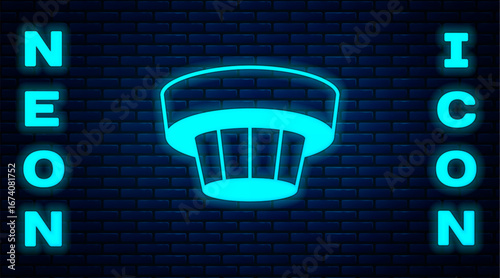 Glowing neon Smoke alarm system icon isolated on brick wall background. Smoke detector. Vector