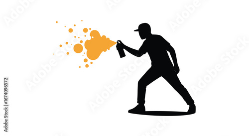 a person spray painting with orange paint
