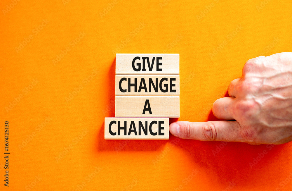 Give change a chance symbol. Concept words phrase Give change a chance on beautiful wooden blocks. Beautiful orange paper background Businessman's hand Business Give change a chance concept Copy space Give change a chance symbol. Concept words phrase Give change a chance on beautiful wooden blocks. Beautiful orange paper background Businessman's hand Business Give change a chance concept Copy space