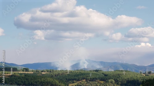 Three active fires emitting a large amount of smoke on one of the slopes of the El Bierzo mountains in the devastating fire that affected the region in the forest fires of 2025