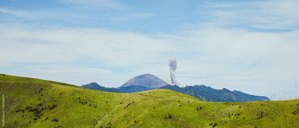 Fototapeta premium Bukit Premium, East Java, Indonesia with Erupting Mount Semeru
