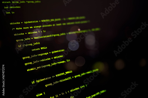 Obraz na płótnie Close-up view of computer programming code on a dark screen, representing software development, cybersecurity, coding, and IT technology in a modern digital environment.