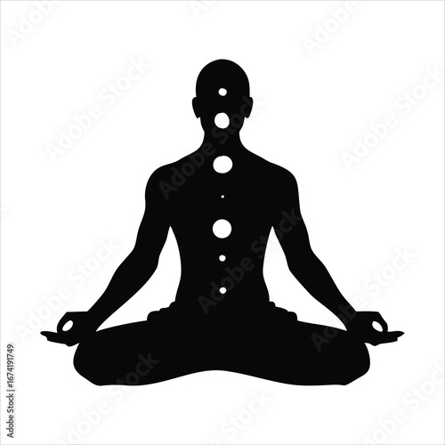 Silhouette of a person meditating with chakras aligned