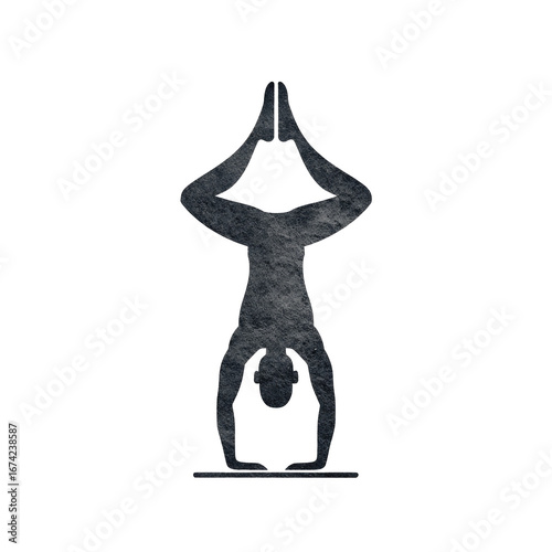 Silhouette of a person upside down in a yoga pose