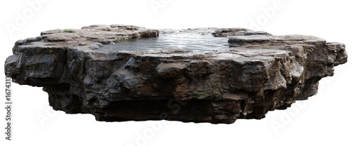 Isolated rock formation with flowing water
