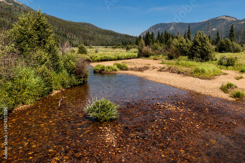 Looking north to the very headwaters of the Colorado River in the Kawuneeche Valley within Rocky Mountain National Park, Colorado in early August