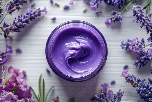 Lavender Cream Surrounded by Fresh Lavender and White Flowers on a Wooden Sur...