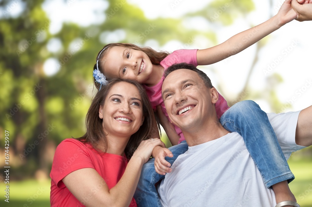 Naklejka premium Happy, love young parents with child in park