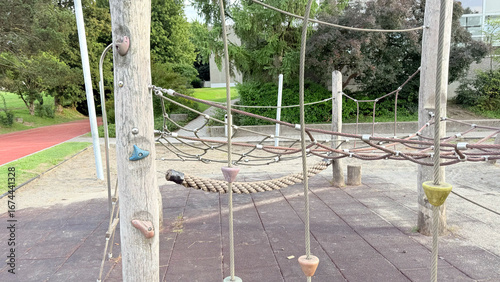 Wooden eco playground rope climbing structure with slide, natural adventure park equipment for children in outdoor park, sustainable design for kids recreation and physical activity