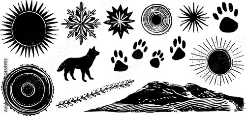 Arctic linocut symbols collection: snowflake, sun, animal tracks, and mountain landscape for design