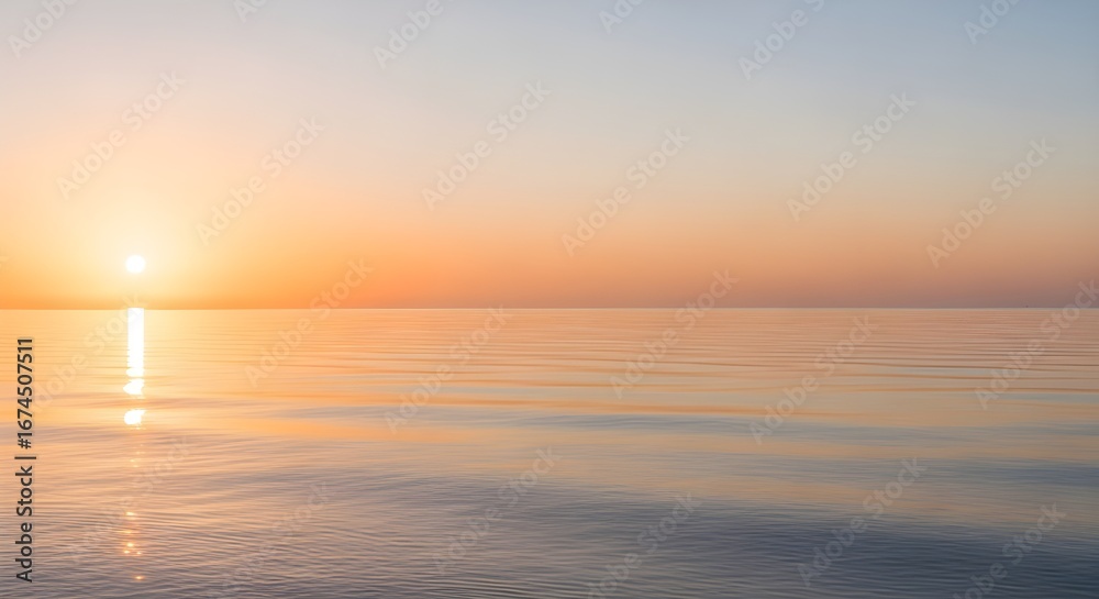 Obraz premium Serene ocean sunset with golden light reflecting on calm, rippling water, evoking peace and tranquility.
