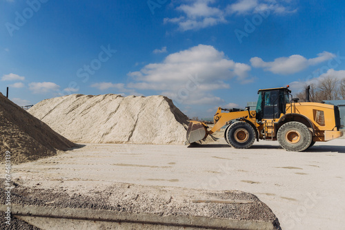 фотографія Wheel loader moving sand in concrete production plant