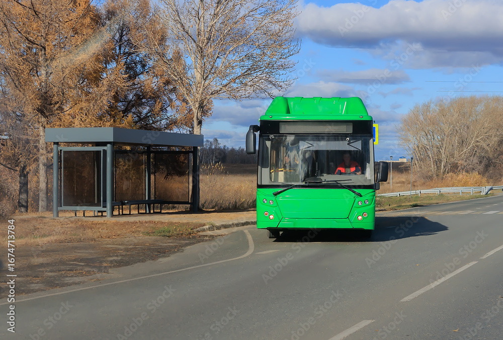 Obraz premium regular bus leaves from a stop