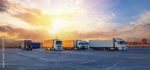 Trucks in parking lot on suburban highway