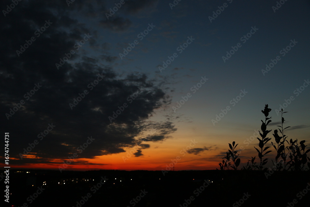 Obraz premium Bright orange sunset in the sky