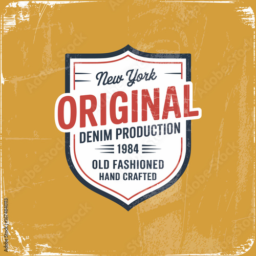 This classic badge showcases the old-fashioned aspects of denim production from New York in 1984, focusing on traditional craftsmanship and a vintage aesthetic appealing to enthusiasts.