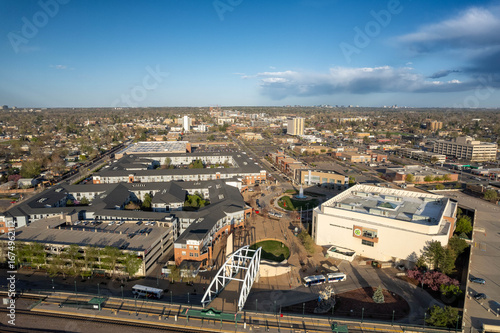 Aerial view of highway interchange and suburban development in Englewood with Denver skyline visible in distance, Colorado, USA